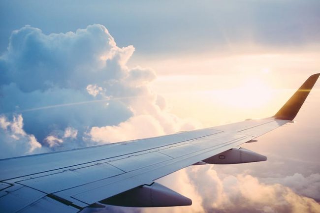 CBD-and-Travel-Blog-Image-OFW image of airplane wing in the sky