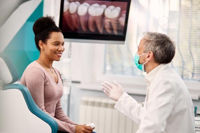 dental-health-blog-img-OFW woman discussing using cbd for oral hygiene and wellness with a dental health professional